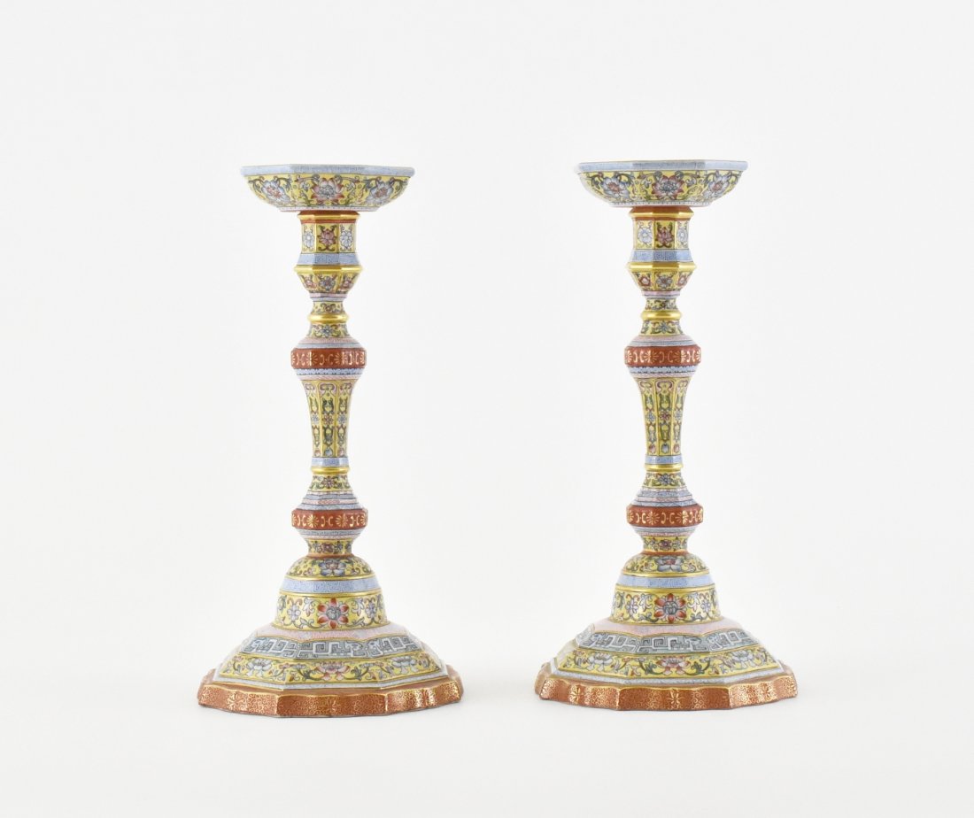 PAIR OF SGRAFFIATO-GROUND FAMILLE JAUNE CANDLE HOLDERS: of tall octagonal spherical form, with round dish resting on top, raised on prominent bell-shaped foot, wealthy decorated in vivid colorful famille rose painting of rococo floral foliage over the jaun