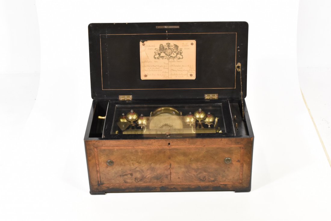 SWISS ORCHESTRAL CYLINDER MUSIC BOX: playing six airs on one 13" cylinder, six saucer bells each with bird strikers, two sets of bells centering a snare drum, divided 3-part comb with all teeth intact, burl wood with inlay banding case,