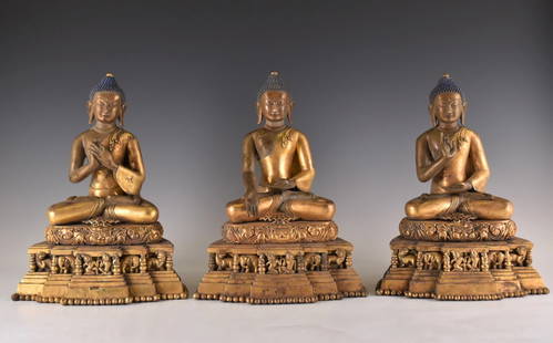 IMPORTANT, SET OF 3 GILT BRONZE SHAKYAMUNI BUDDHA'S: IMPORTANT, SET OF 3 GILT BRONZE SHAKYAMUNI BUDDHA'S figures. Ming Dynasty Period and of the period (1368-1644). Cast in formal in appearance are seated in 'dhyanasana' on a double-pedestal base.