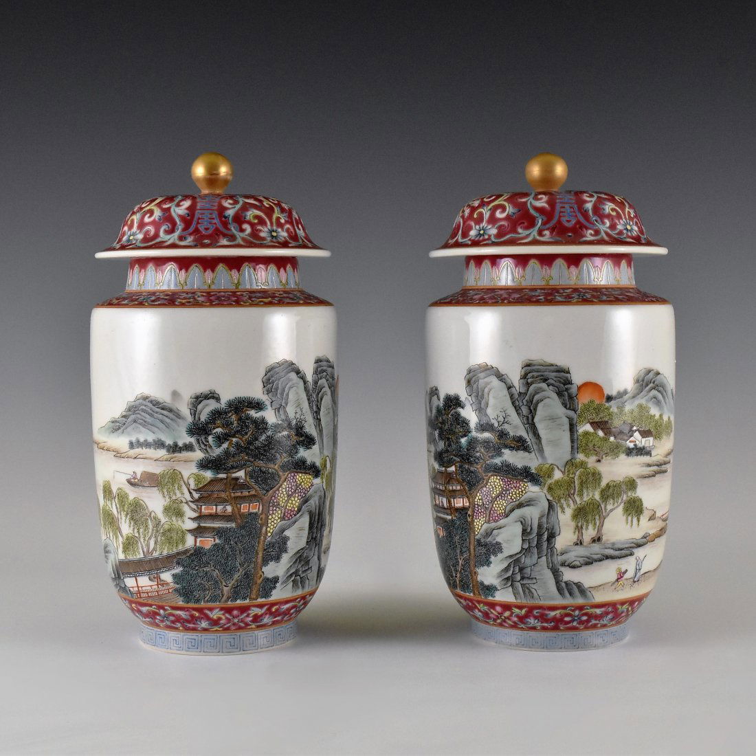 PAIR OF LANDSCAPE MOTIF FAMILLE ROSE LIDDED JARS (1 of 10)