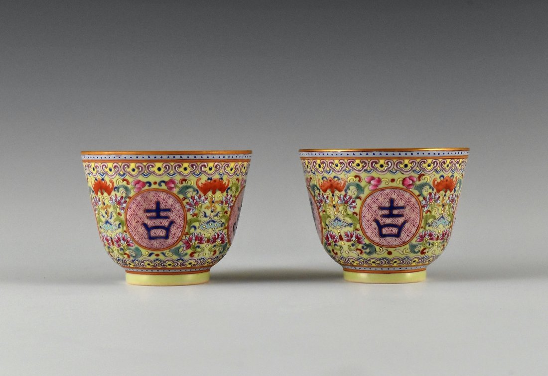 PAIR OF GOOD FORTUNES MEDALLIONS PORCELAIN CUPS: The pair of Chinese porcelain cups having deep bowl body, steep sides raised on rounded cavetto toward flat rim, upon concaved foot base. The exterior decorated with four medallions, each enclosing a
