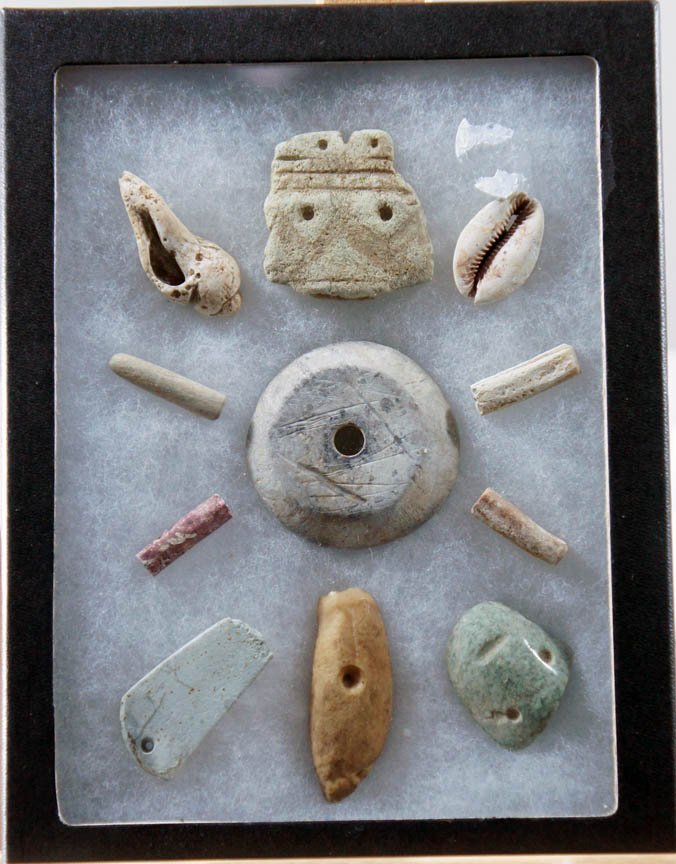 Mitla Antique Carved shells and stone,: eleven carved objects from sea-shells, stone, beads with holes end-to-end, apparently from Mexico, with notation 1000-5000 years old, various materials, all worked for various end uses mainly decorati