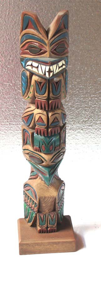 ALASKAN NATIVE TOTEM, ,: Title: (untitled), carved wood, , c. 1985, signed on the bottom (incised in the wood) " Made in Alaska by Ravln, 85" , , , , Size info: 22 by 4 by 3 in (55 x 10 x 7.5. cm.), , , Framing