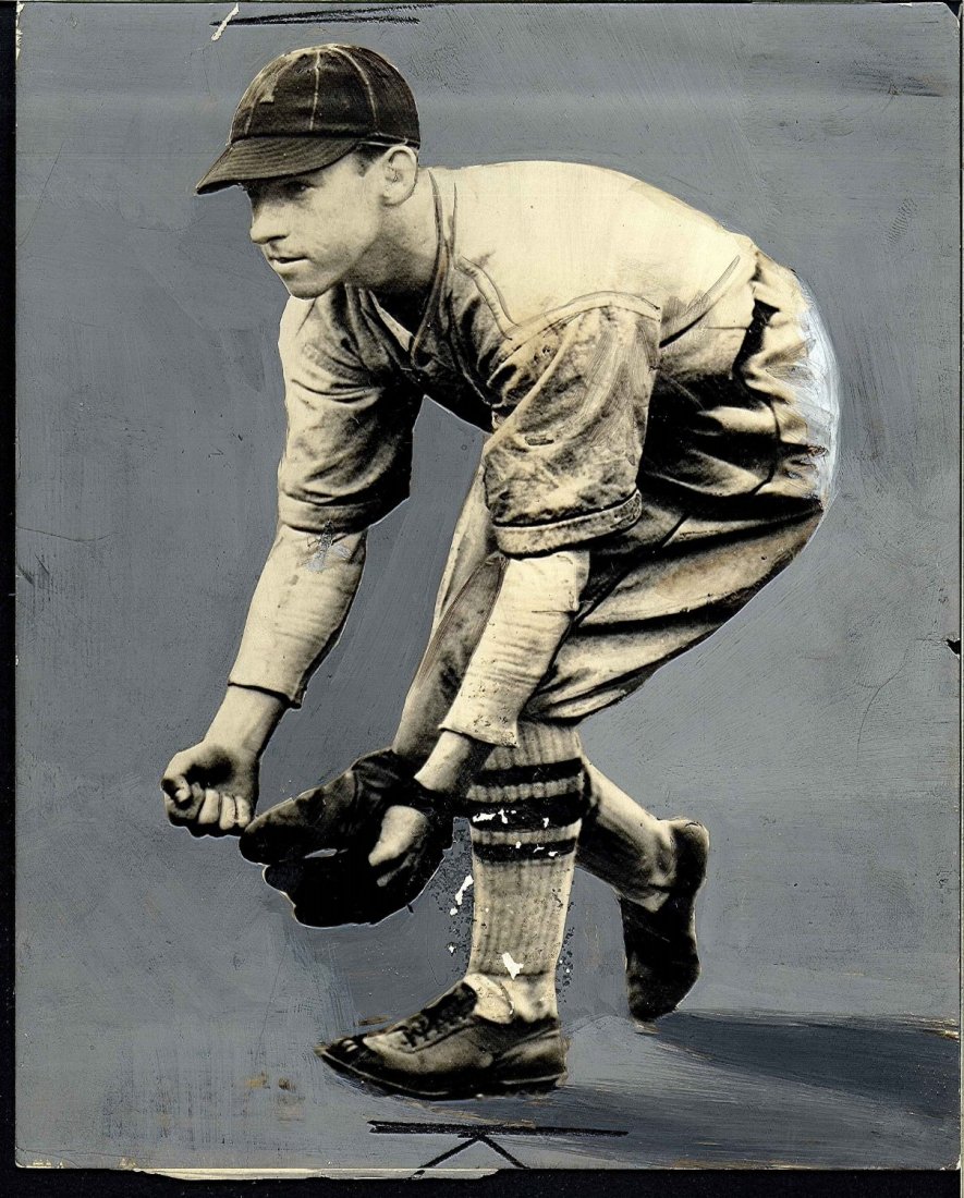 Original Type 1 Photograph of 1930 Athletics Player: Original Type 1 Photograph of 1930 Athletics Player Eric McNair. This photograph features McNair in his Athletics jersey bending over to field a ball and on the reverse is dated March 3 1930. This pho