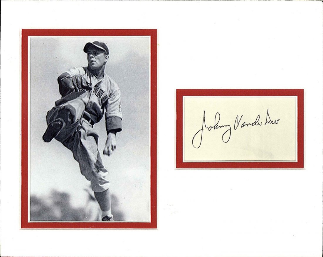 Johnny Vander Meer Cut Signature Matted with a: JSA Johnny Vander Meer cut signature matted with a photograph. This piece has a nice a tan on red double matting theme and measures 10 x 8 inches. John Samuel Vander Meer (November 2, 1914 – October