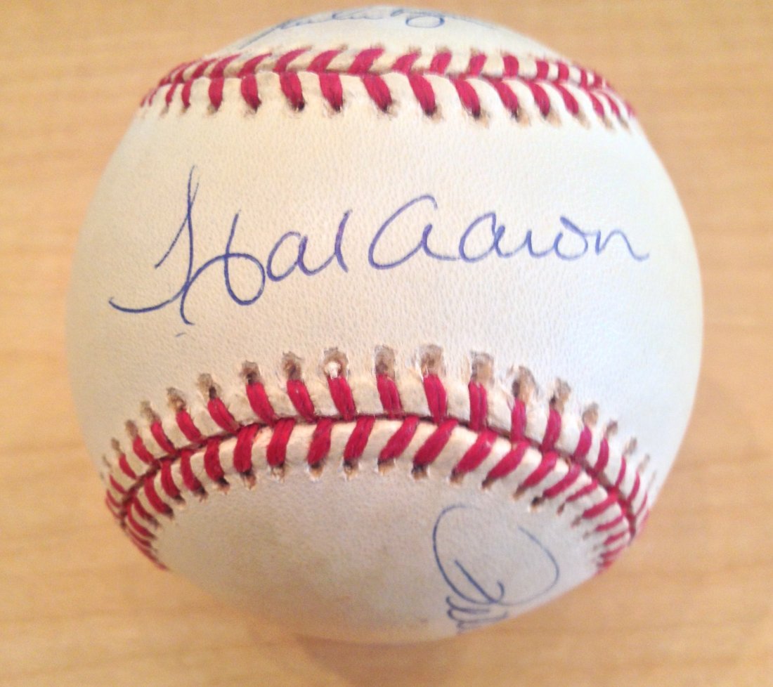 Hank Aaron, Nolan Ryan and Pete Rose Signed Baseball: Hank Aaron, Nolan Ryan and Pete Rose Signed Baseball Certified by The Score Board. Hank Aaron is on the sweet spot, Pete Rose is on one side panel and Nolan Ryan on the top panel. This is on an offici