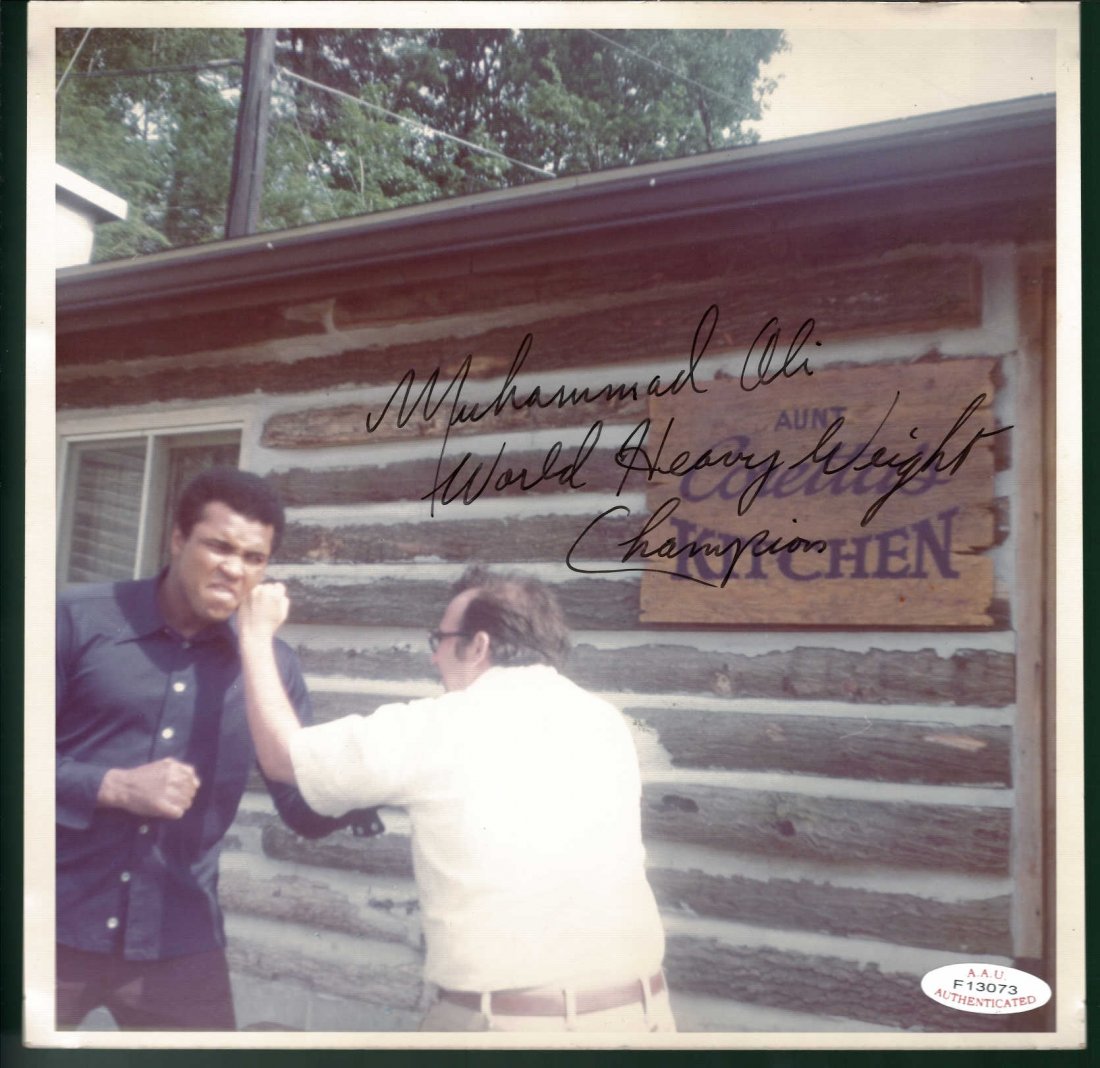 Muhammad Ali Signed Photograph AAU Certified: Muhammad Ali Signed Photograph AAU Certified this photograph is 8 x 8 inches.