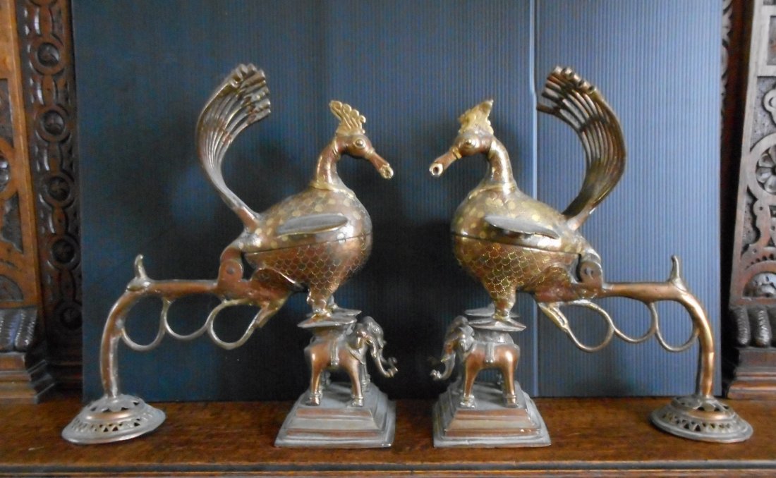 Pair of Peacock with Elephant Incense burners: Extraordinary pair of incense burners which appear to be 2 large peacocks standing over a pair of elephants. The tops pull back to put in the incense and it comes out of a group of hollow tubes formin