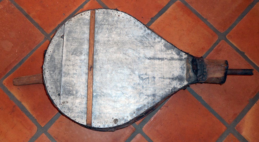 Mid 19th Century Fireplace Bellows from Columbia: This antique fireplace bellows dates to mid 19th C. Columbia. It is made of leather, wood and tin, is delicate and I would not expect it to work.