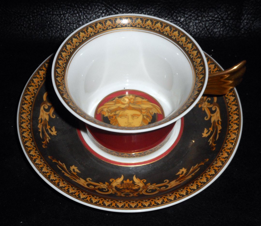 Versace Cup and Saucer Medusa 1: This is 1 of 2 cup and saucer sets from Versace, Medusa. This auction is only for 1 of them.WIN 5 ITEMS IN THIS AUCTION AND YOU CAN CHOOSE (YOUR CHOICE) A 6TH THAT HAS NOT BEEN BID ON FOR FREE.WIN 8 I