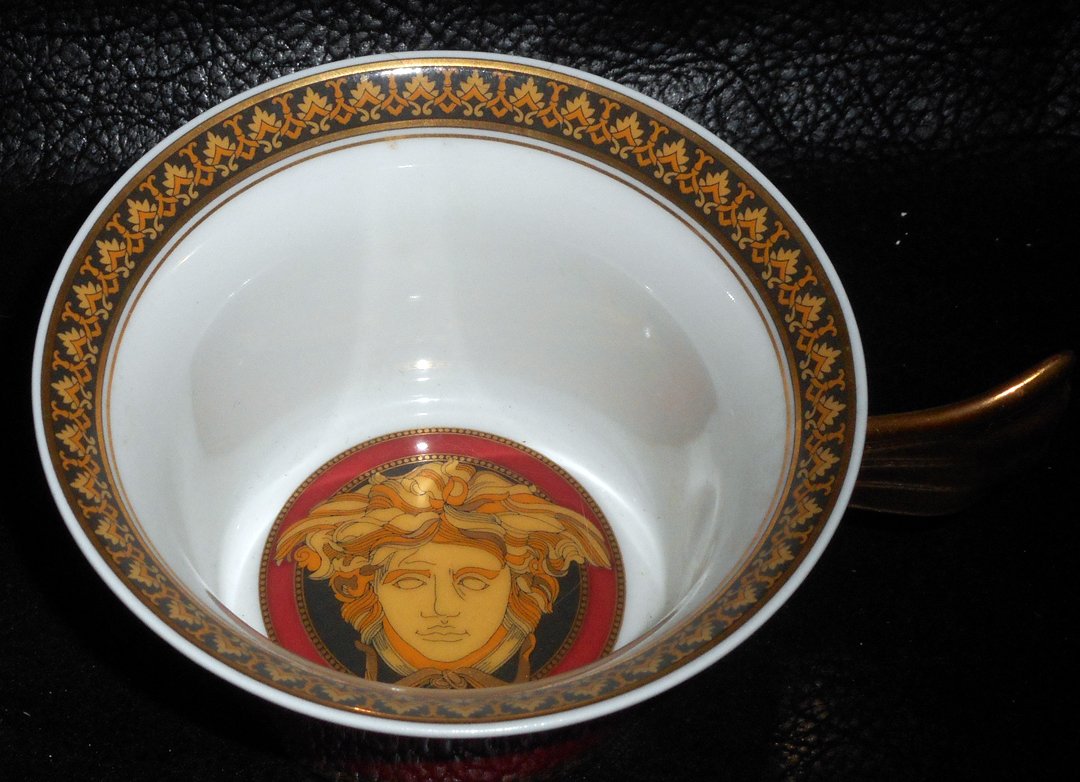 Versace Cup Medusa NO SAUCER: This is only the cup from a Versace cup and saucer set. The pattern is Medusa.WIN 5 ITEMS IN THIS AUCTION AND YOU CAN CHOOSE (YOUR CHOICE) A 6TH THAT HAS NOT BEEN BID ON FOR FREE.WIN 8 ITEMS AND I WIL