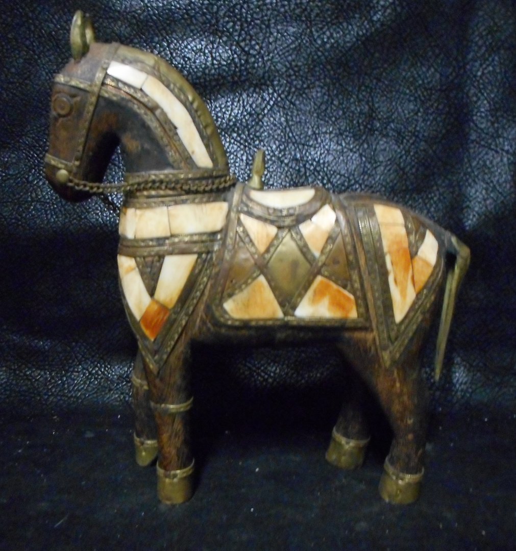 Carved Wooden Horse from Chile: Exquisite carved horse from Chile and detailed in Walrus bone.This horse is about 50 years old. It measures about 8 inches high.WIN 5 ITEMS IN THIS AUCTION AND YOU CAN CHOOSE (YOUR CHOICE) A 6TH THAT 