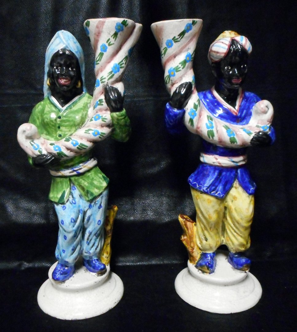 Pair of Italian Blackmoor figures: Vases.: Two magnificent Italian Blackmoor porcelain figures holding a cornucopia which doubles as a vase. They are open in the center.They are large (about 18 inches tall each)