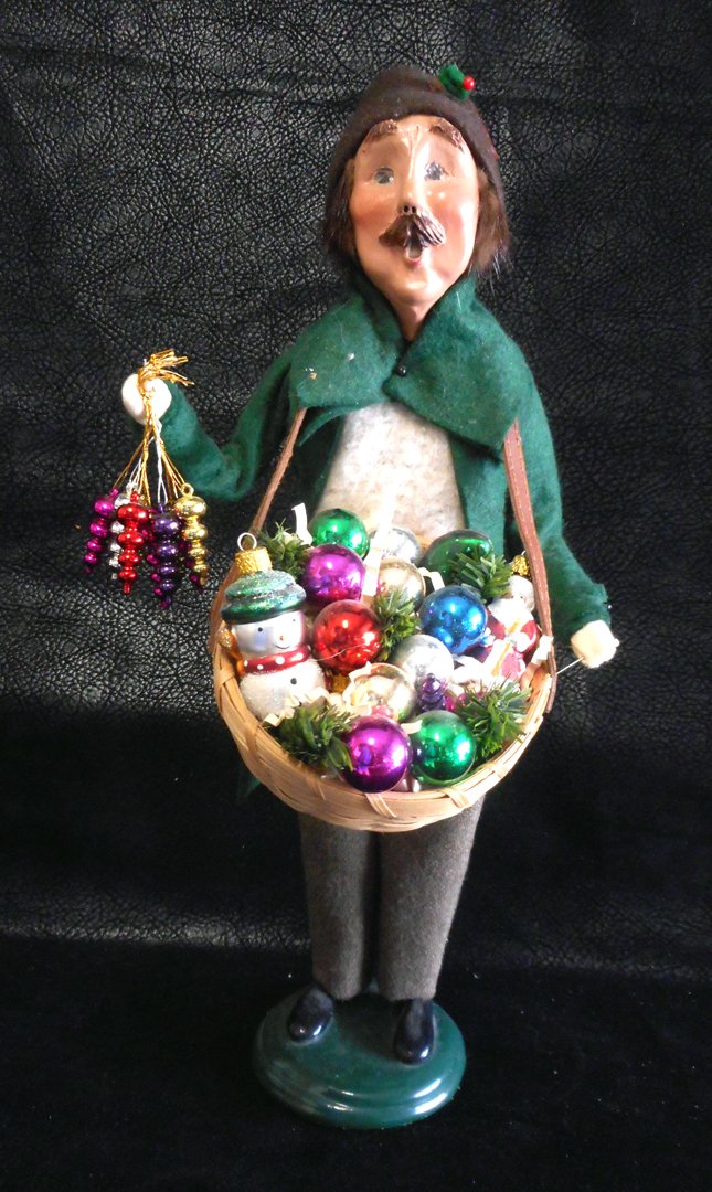 Byers Choice Caroler with basket of Ornaments: Pretty rare Byers Caroler. The caroler series has many available Christmas Carolers and they range in price from as little as $10. to as high as $150. This one has sold a couple of times on Ebay in th