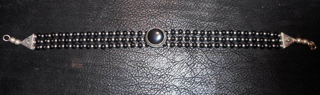 Silver and Onyx Choker: Onyx stones set in silver.