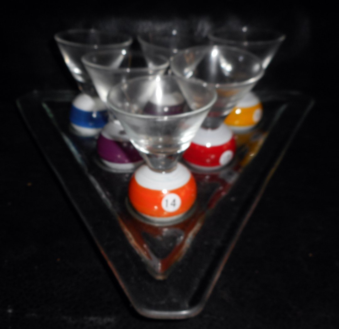 Billiard Ball Shot Glass Set: Very cool billiard ball shot glass set on a lucite style base.The glasses are 3 1/2 inches high by 2 1/2 inches wide.