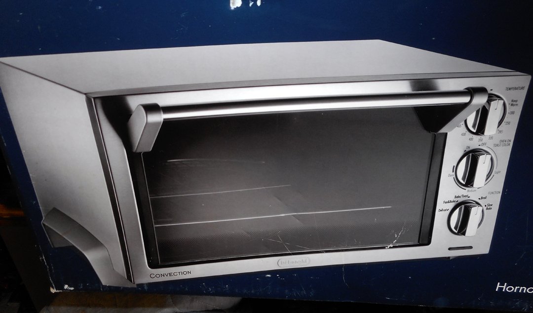 Delonghi Convection Oven Grill Brand New in Box: This is a brand new Delongi Convection Stainless Steel Oven Grill. It is still in the box with all guarantees etc. The pictures show the item still unopened in the box. The box is not perfect which is