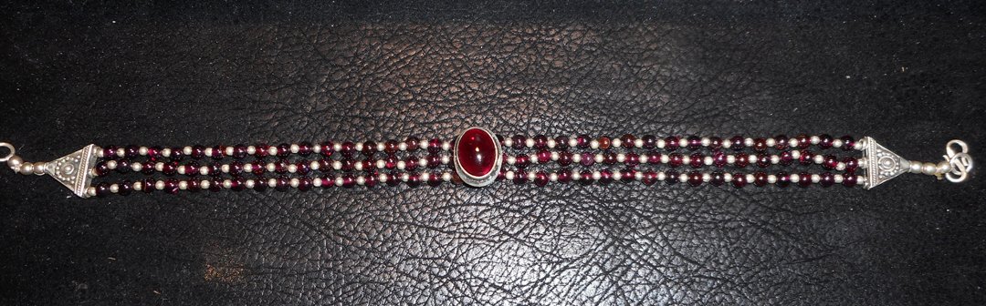 Silver and Garnet Choker: This looks like a garnet. Actually, I am not sure. I am sure it is silver 9.6. If it is not a garnet it is probably some tourmaline.