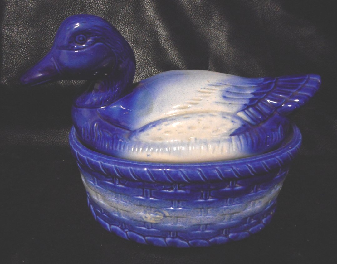 Large Duck Container: This is a striking duck container. The top removes similar to that of a cookie jar. Just a great decorative item.