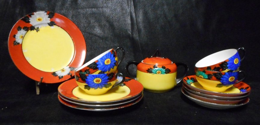 Noritake Tea Set: Set includes 4 cups and saucers, 4 luncheon plates and what appears to be a covered bowl or Sugar holder.