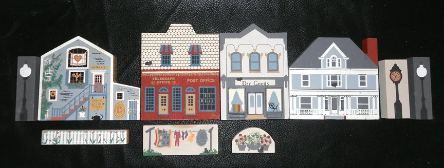 10 Pieces of Cats Meow Buildings, Lamps etc.: These are 10 pieces of the Cats Meow Buildings from the late 80's. They are flat buildings and these represent places like the Post Office. They are all made of wood and nicely hand decorated and of c
