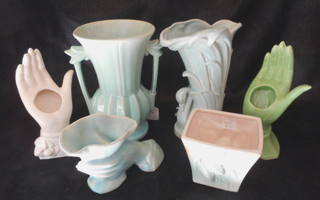 6 Pieces of McCoy Pottery: 2 large vases, 2 vases in the shape of hands, 2 other vases.All 6 for a single winning bid. All of these pieces are McCoy Pottery ranging in age from the 1940's and 1950's.