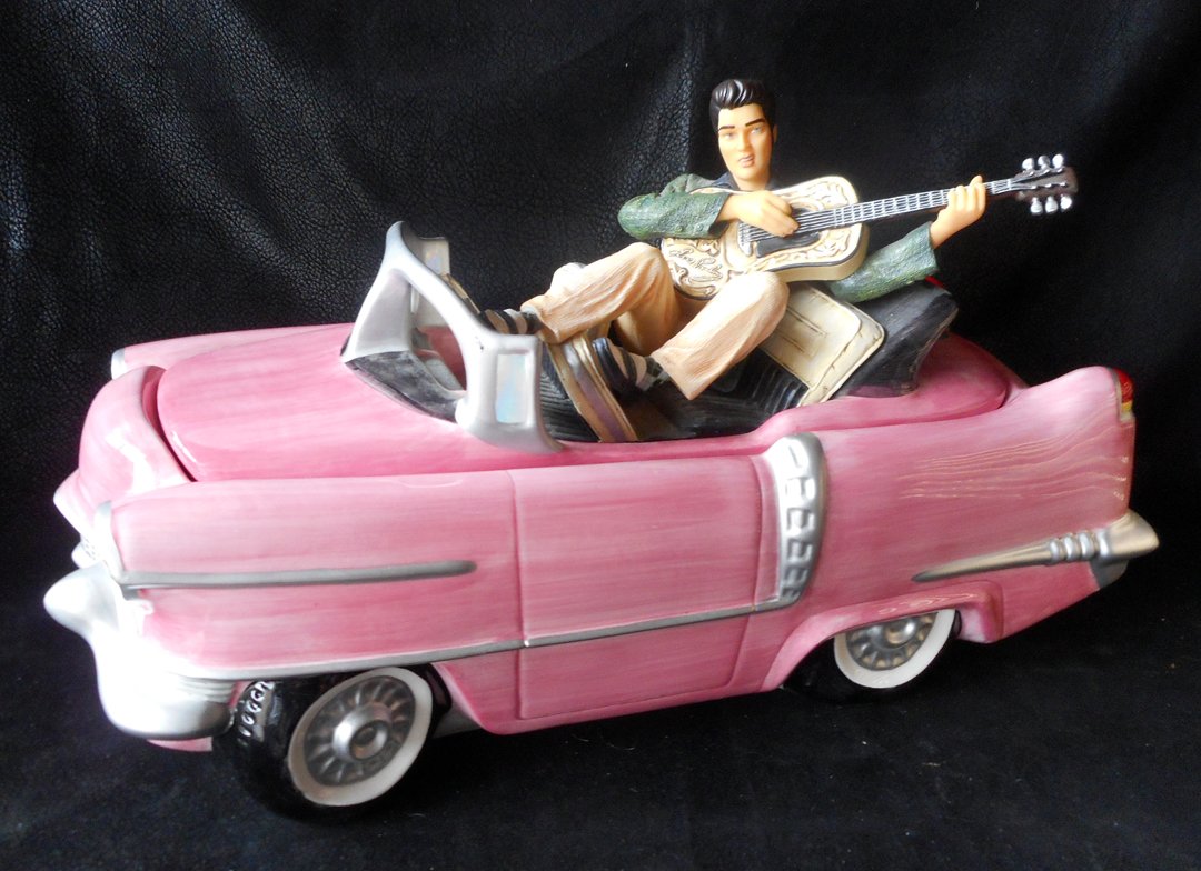 Elvis Cookie Jar in Pink Cadallac: Great Cookie Jar of Elvis in his pink Cadillac. Jar is about 14 inches wide and in perfect condition. The box is included but I only have part of the original interior packing. This jar was produced i