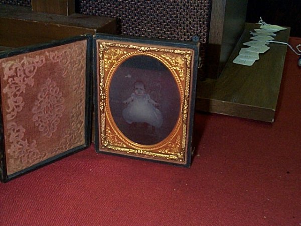 Ambrotype photograph in a leather case, that needs 