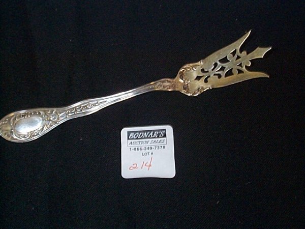 Sterling silver fish serving fork with a gold wash