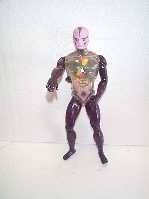 Mattel Action Figure of a purple alien with a spi: Mattel Action Figure of a purple alien with a spinning device in his chest. Signed Mattel 1978. Measures 13" h. Buyer to pay $20.00 shipping and handling, all items to be sent USPS Priority Mail with