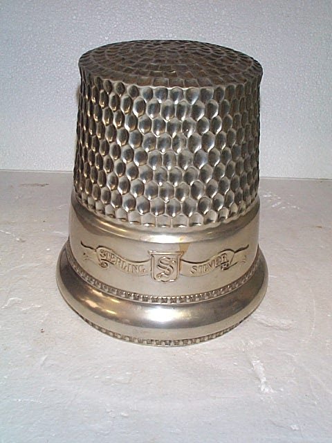 One of a kind store display oversized thimble mark