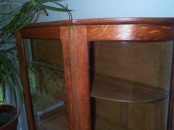 oak bow-front china closet. Item can be picked up - 2