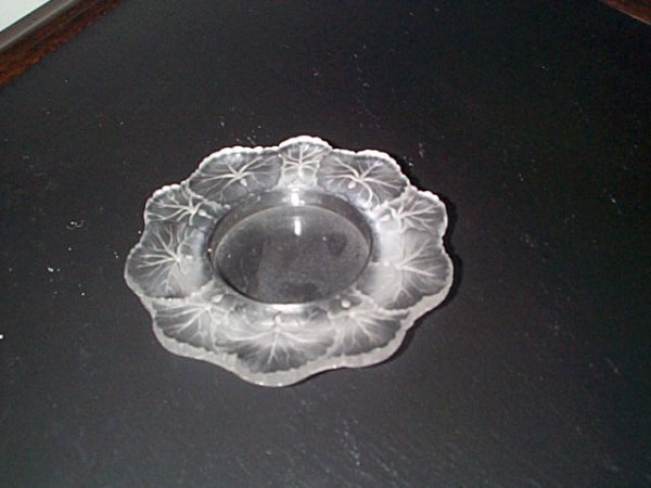 Signed Lalique flowered dish. Measures 6" diamete