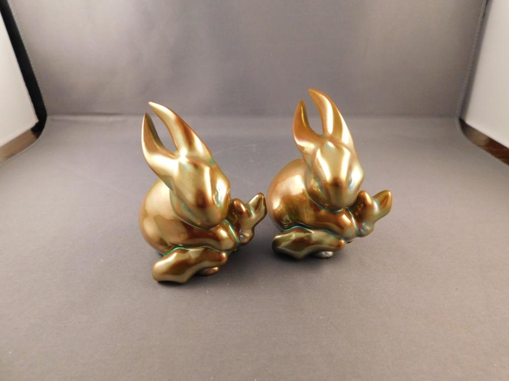 Pair of Zsolnay Art Pottery Snails: Zsolnay Hungarian pair of iridescent yellow bunnies. Measures approx. 3" tall. You are bidding at a live sale. Please Read the terms and conditions. We are offering scheduled pick-ups of items at our