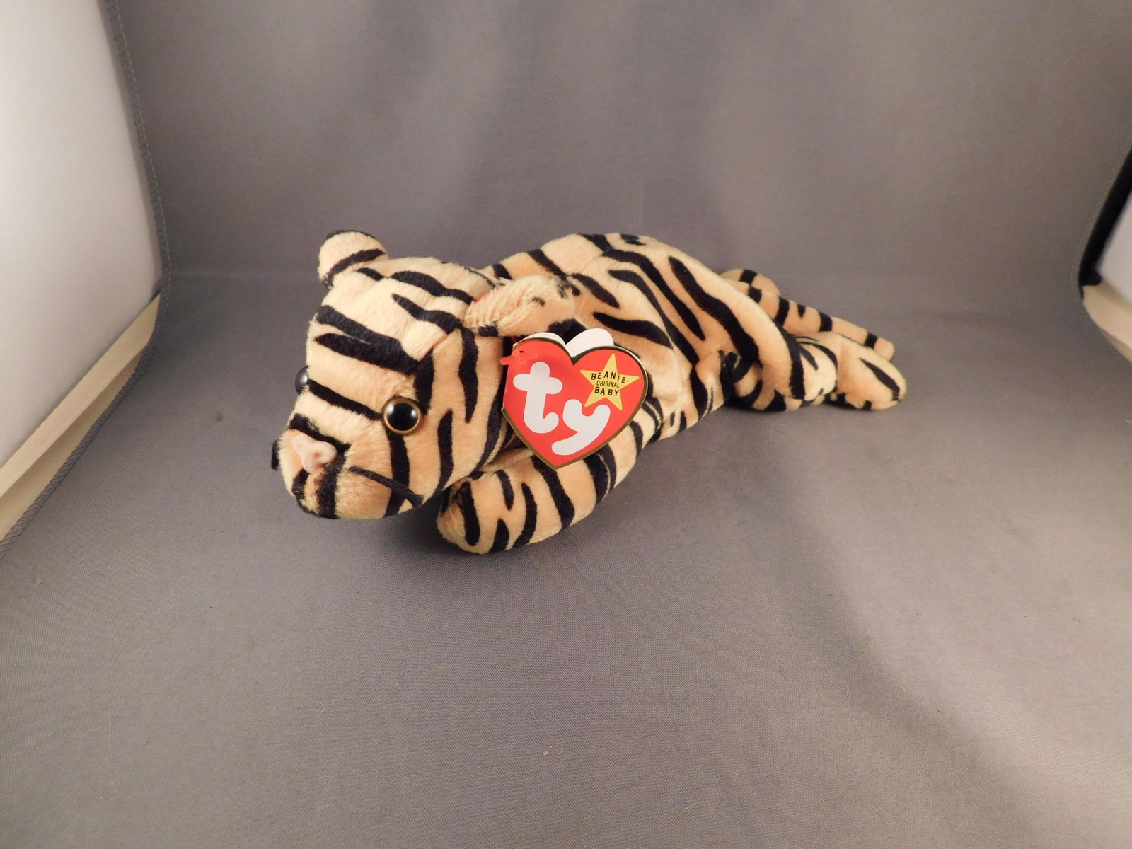 Rare Stripes Beanie Baby: Rare Stripes error Beanie Baby. Swing tag has no U.K. after 5TX, Nurnberg, an extra space between Birth and :, and has the old style date on the tag. Tush tag has no stamp and no star, also has 1965(K