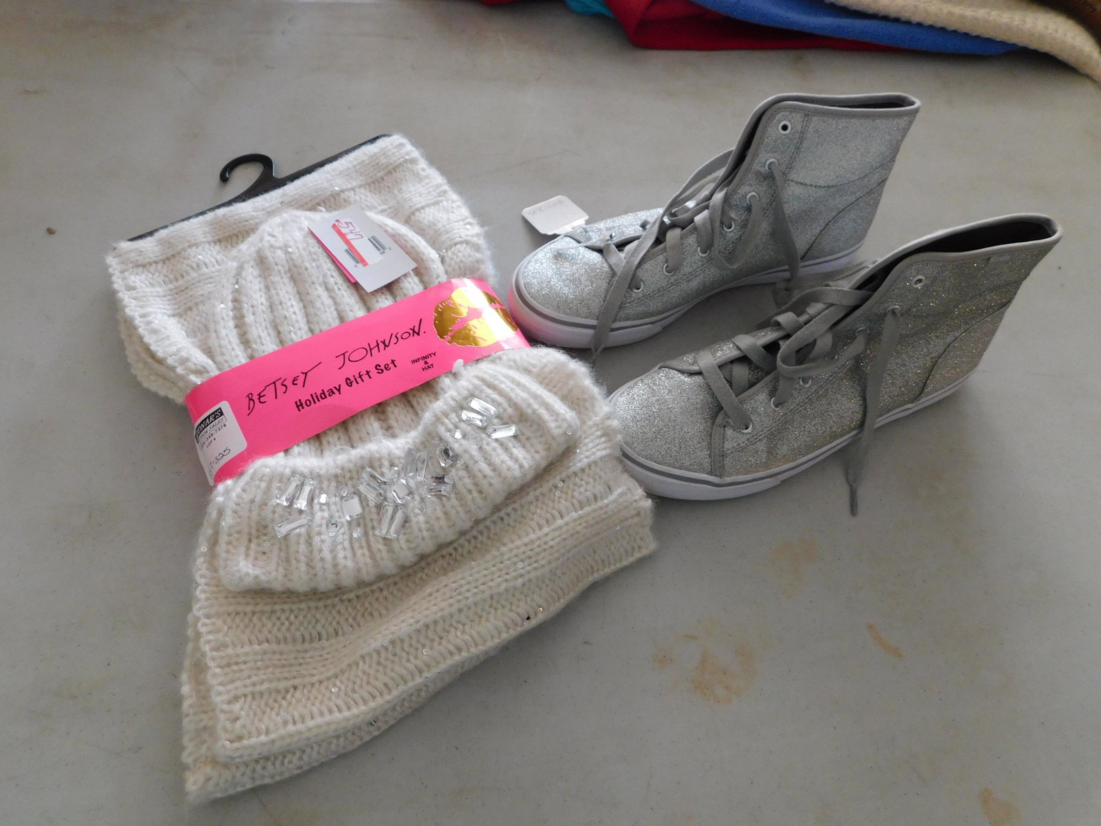 Keds and Betsy Johnson: Keds silver sparkly high top sneakers size 8 1/2 and a Betsy Johnson infinity scarf and hat set. You are bidding at a live sale. Please read the terms and conditions. We are offering appointment only