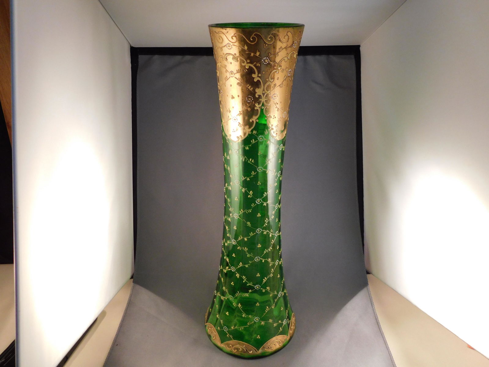 Tall Hand Painted Vase: Tall hand painted vase with flowers in relief. Measures approx. 16 1/2" tall x 5" wide. You are bidding at a live sale. Please read the terms and conditions. We are offering no contact pick up at our