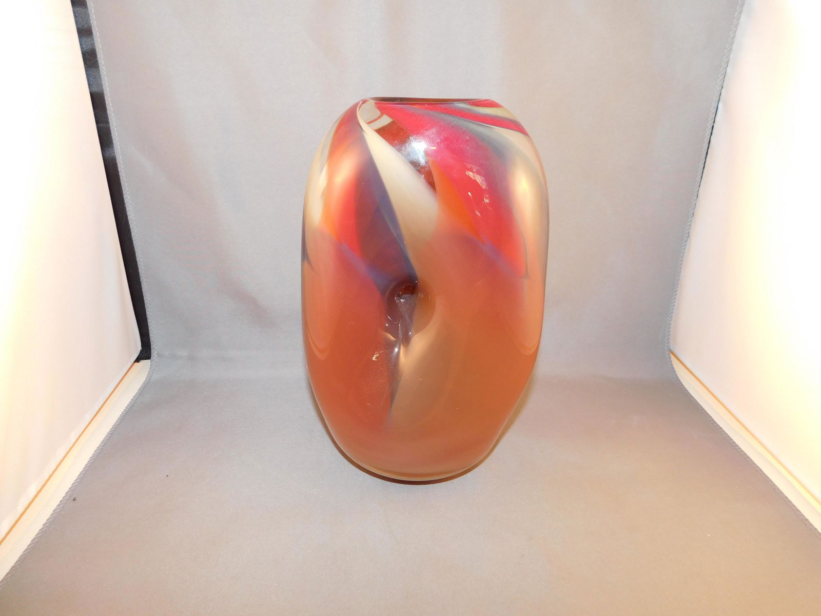 Kingwell Art Glass Vase: Art glass unusual form vase with belly button pushed in center. Artist signed Kingwell - Ice Fire - 88021504. Measures approx. 8" tall x 5" wide. You are bidding at a live sale. Please read the terms