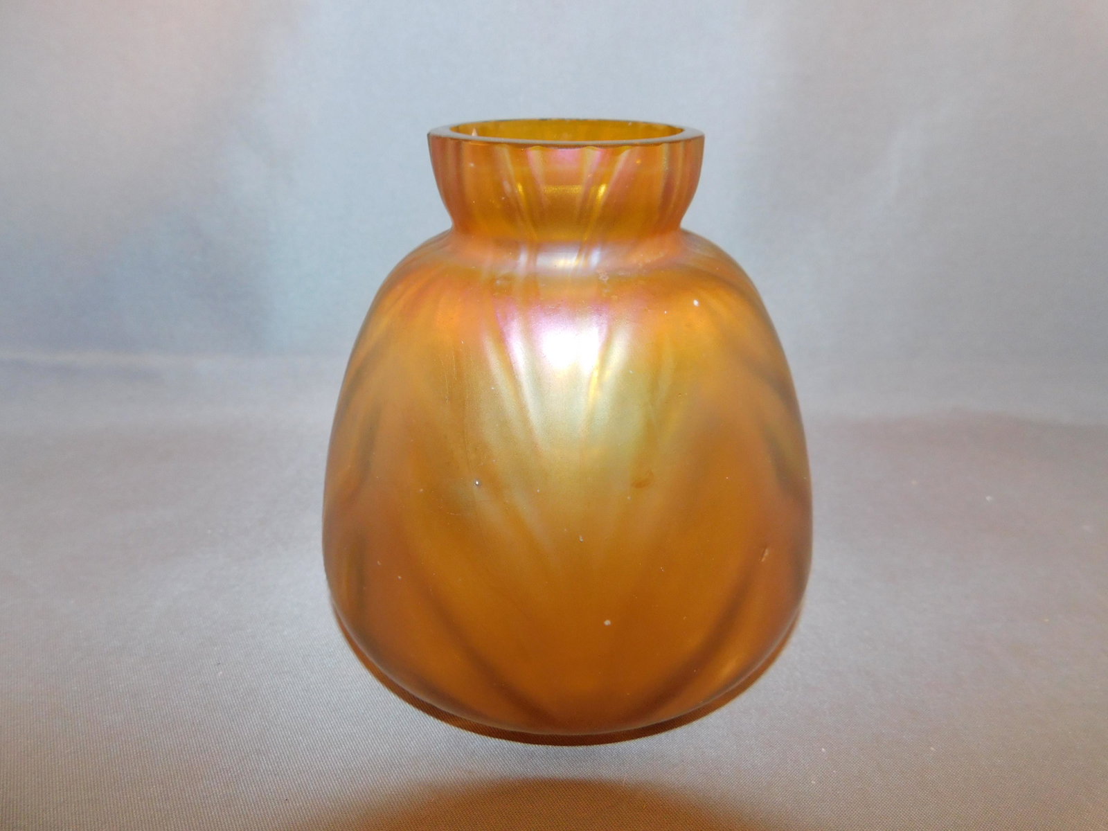 Loetz Art Glass Vase: Loetz art glass vase. Measures approx. 4" tall x 4" wide. You are bidding at a live sale. Please read the terms and conditions. We are offering no contact pick up at our South Brunswick location, or s