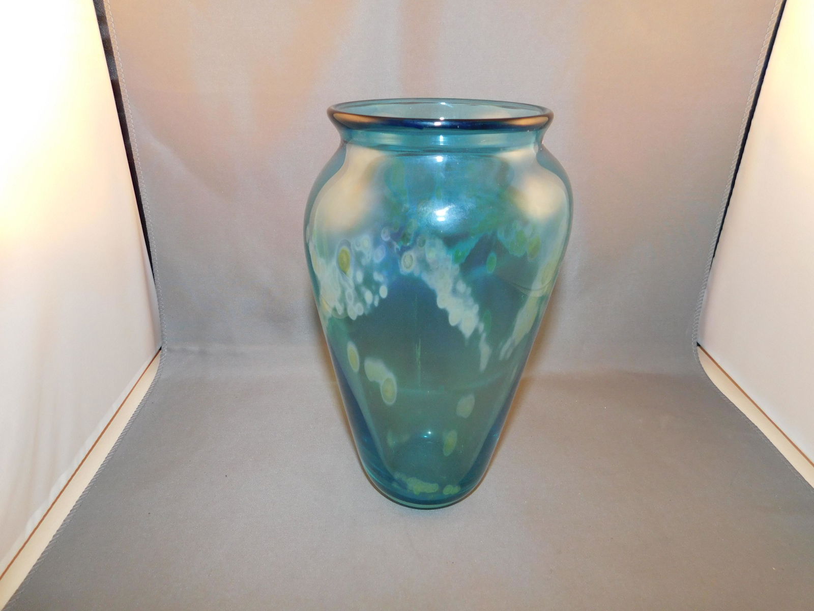 Art Glass Vase: Art glass vase signed J Mayoleson 1990. Measures approx. 7 1/2" tall x 4 1/2" wide. You are bidding at a live sale. Please read the terms and conditions. We are offering no contact pick up at our Sout