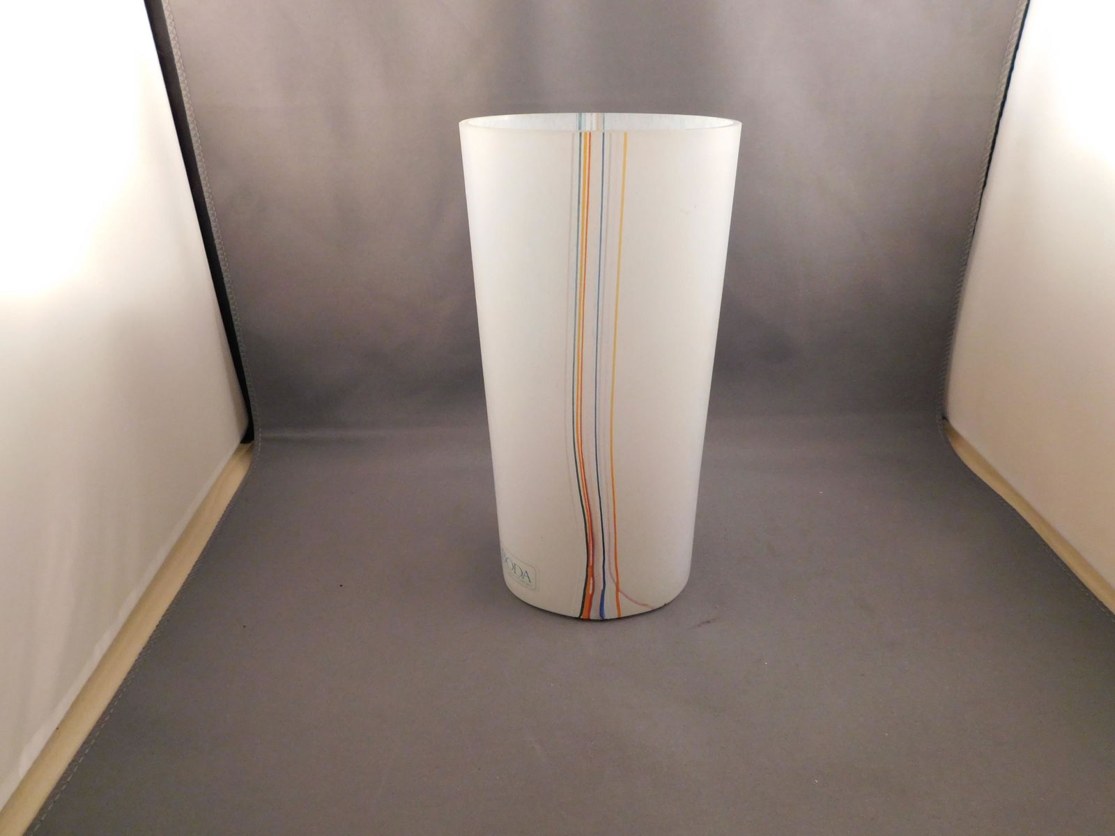 Kosta Boda Art Glass Vase: Art glass vase with sicker - Kosta Boda, Sweden. Measures approx. 7 1/2" tall x 3 1/2" wide. You are bidding at a live sale. Please read the terms and conditions. We are offering no contact pick up at