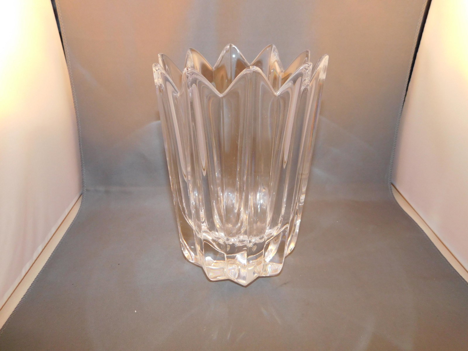 Orrefors Crystal Vase: Orrefors crystal vase. Marked orrefors on the bottom. Measures approx. 7 1/2" tall x 5" wide. You are bidding at a live sale. Please read the terms and conditions. We are offering no contact pick up a