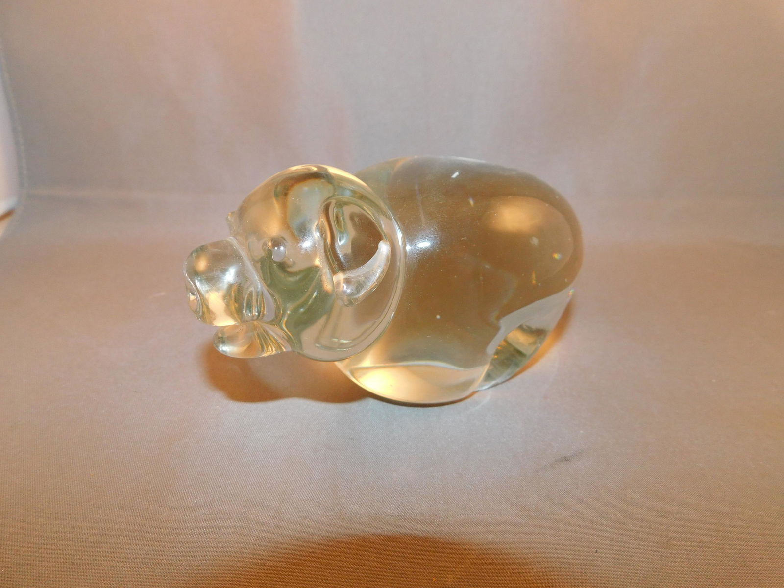 Art Glass Pig: Art glass pig signed Jon, '75. Measures approx. 2 1/4" tall x 4 1/4" wide. You are bidding at a live sale. Please read the terms and conditions. We are offering no contact pick up at our South Brunswi