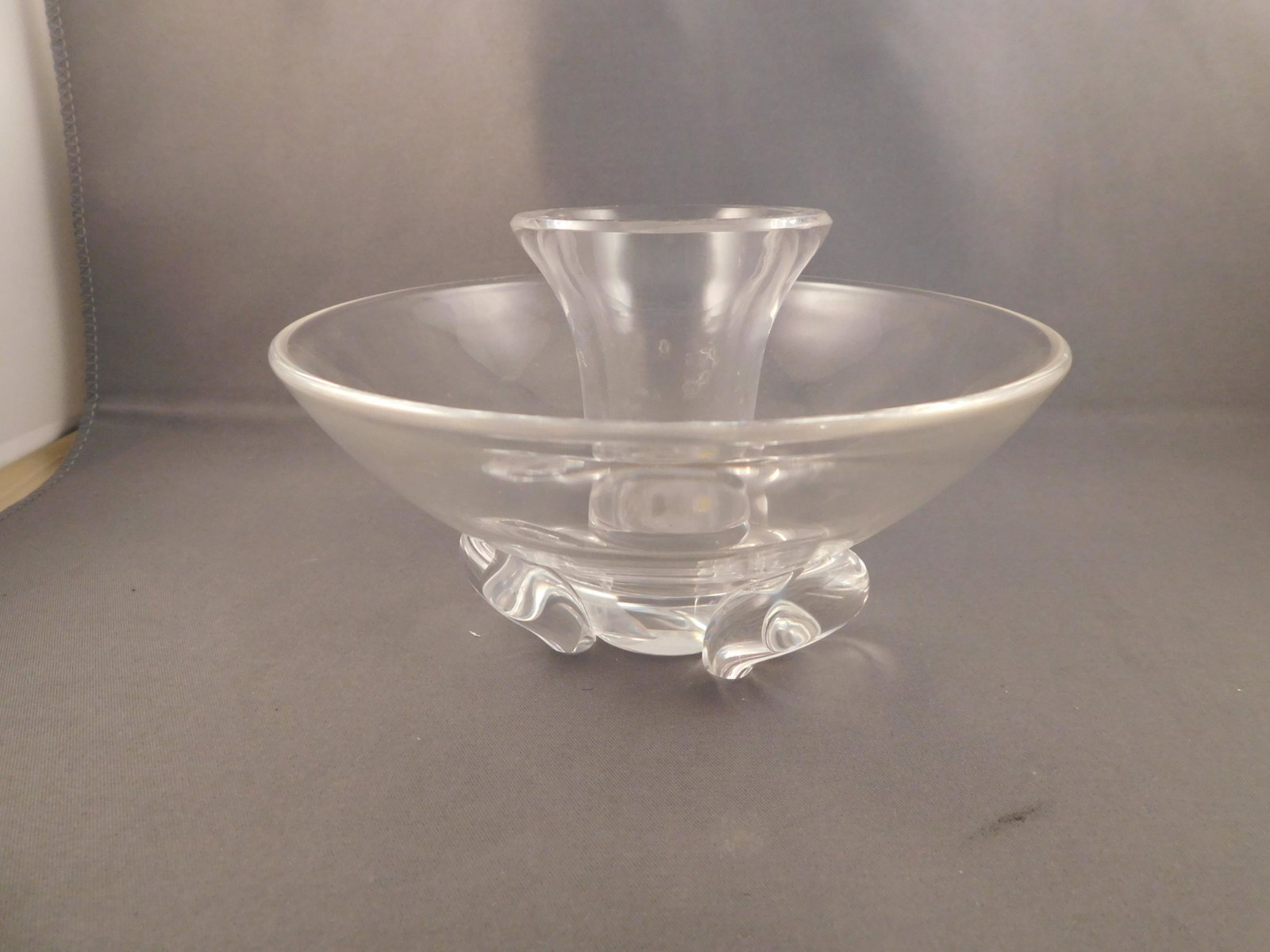 Stuben Art Glass Candlestick: Art glass candlestick signed Stuben. Measures approx. 3 1/4" tall x 5 1/4" wide. You are bidding at a live sale. Please read the terms and conditions. We are offering no contact pick up at our South B