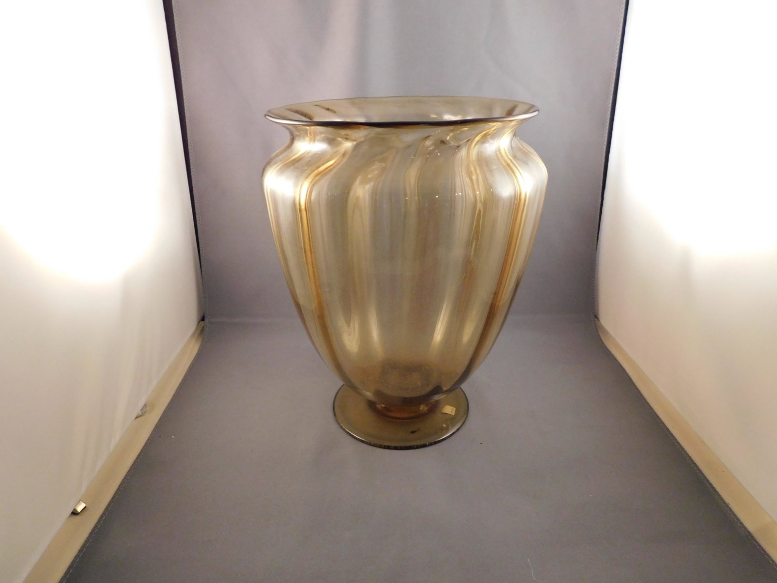 Art Glass Vase: Yellow art glass vase. Measures approx. 9" tall x 6 3/4" wide. You are bidding at a live sale. Please read the terms and conditions. We are offering no contact pick up at our South Brunswick location,