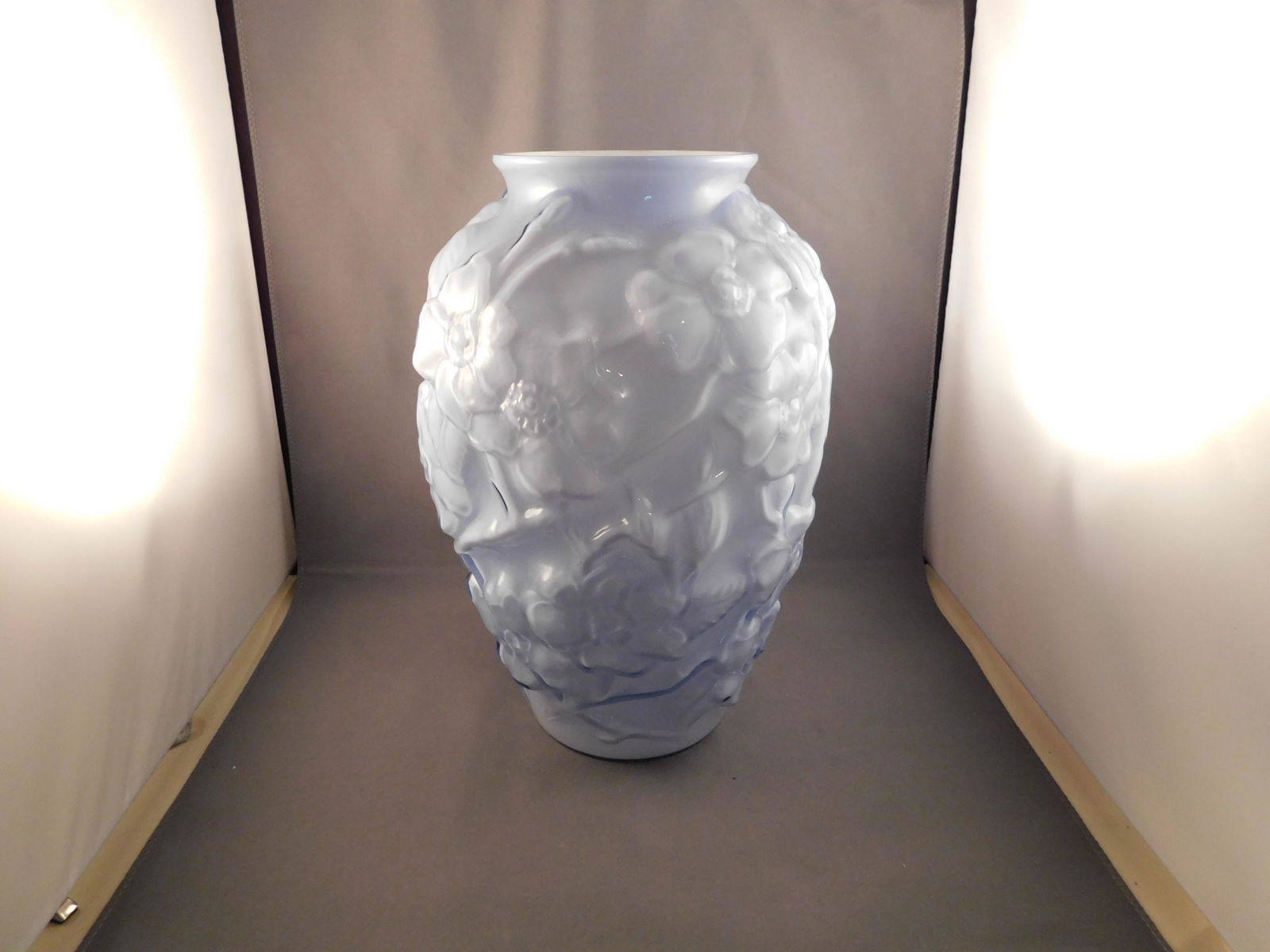 Art Glass Vase: Art glass encased glass vase with a floral pattern in a phoenix glass style. Measures approx. 10 1/2" tall x 6 1/2" wide. You are bidding at a live sale. Please read the terms and conditions. We are o