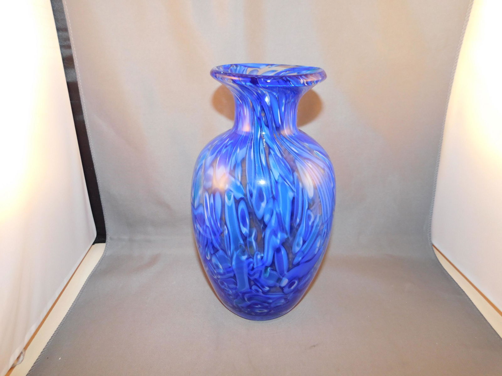 Art Glass Vase: Art glass vase in a blue swirl. Measures approx. 8 1/2" tall x 5" wide. You are bidding at a live sale. Please read the terms and conditions. We are offering no contact pick up at our South Brunswick