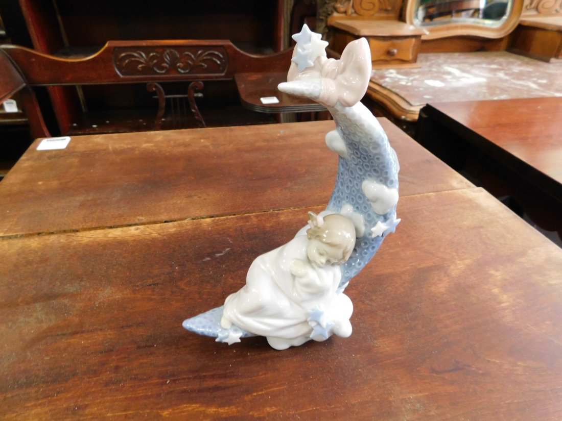 Lladro #6583 Girl Sleeping on Moon: Lladro figurine #6583 girl sleeping on moon. Measures approx. 8 1/2" tall x 6" wide. You are bidding at a live sale. Please read the terms and conditions. We are offering no contact pick up at our Sou