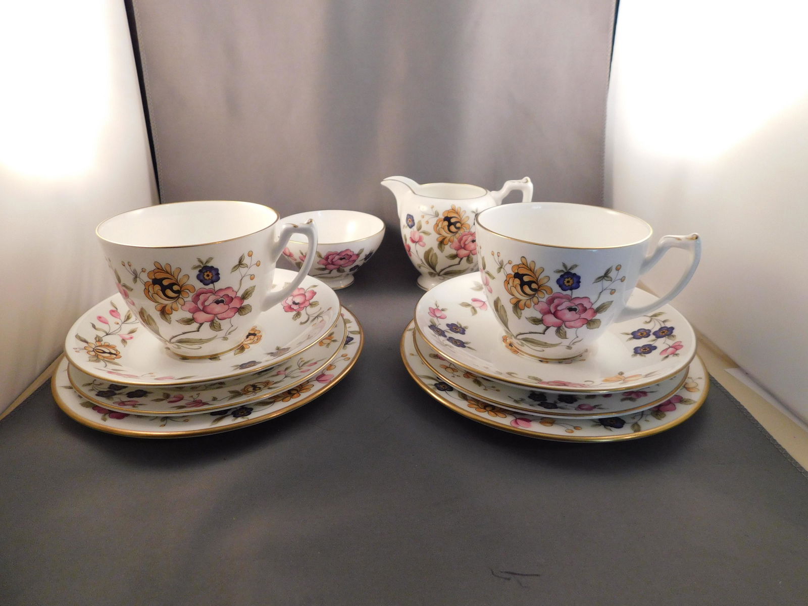 Lot of Coalport Pieces: Lot of Coalport pieces including 2 cups and saucers, creamer, finger bowl and 4 small plates. Measures approx. 1/2" - 3" tall x 3 1/2" - 7" wide. You are bidding at a live sale. Please read the terms