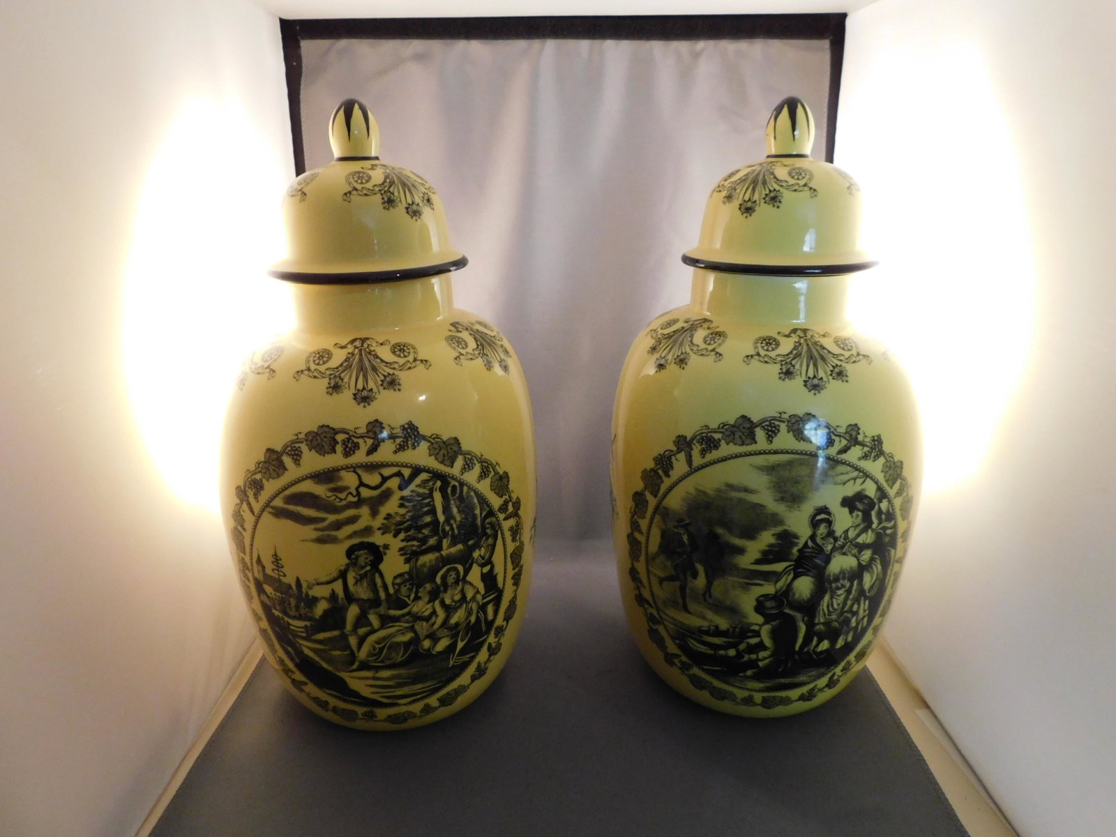 Pair of Covered Urns: Pair of covered urns signed A Mottahedeh Design, Italy. Numbered S5036. One lid has a repair to a chip and the other has a small chip to the bottom rim. Measures approx. 13 1/4" tall. You are bidding 